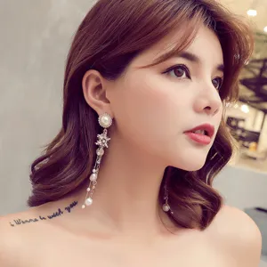 Exquisite long tassel pearl snowflake earrings featuring sparkling rhinestones and elegant design details.
