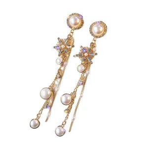 Luxurious long pearl snowflake tassel earrings with sparkling rhinestones, golden drop design.