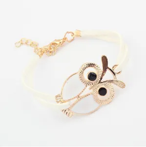 Korean style vintage fashion owl bracelet with white leather band and gold alloy charm.