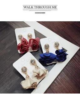 Fabric flower rhinestone dangle earrings detail view, elegant floral design jewelry.