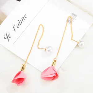 Delicate long tassel earrings featuring pearl studs and pink fabric rose flower pendants.
