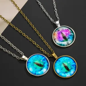 Close-up detail of colorful cat eye glass cabochon pendant necklaces with metal chains.