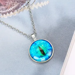 Close-up detail of the colorful cat eye eyeball glass cabochon pendant necklace silver chain.