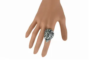 Vintage silver lion head ring detail shot showing intricate mane texture and bold retro design.