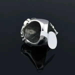 Detailed view of vintage lion head ring, showcasing intricate metal casting and inner band design.