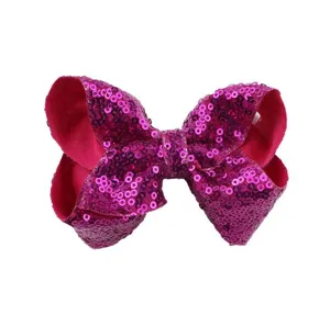 Roze pailletten haarstrik clip voor dames en kinderen glanzende feest haaraccessoire detail.