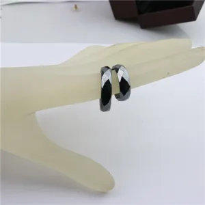 Black magnetic faceted ring for men and women, simple design multi-size jewelry detail.