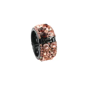 Rhinestone round hair clip detail showing sparkling crystals and black ponytail holder base design.