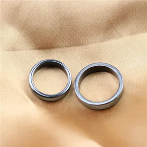 Detailed close-up view of multi-faceted magnetic rings, minimalist black magnetic jewelry.