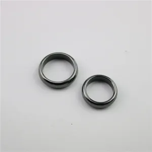 Minimalist black magnetic hematite rings for men and women, classic plain band design.