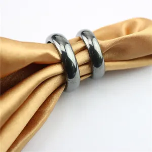 Minimalist magnetic hematite rings for men and women, stylish black metal band detail.