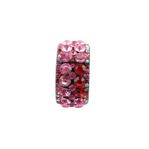 Close-up detail of the sparkling pink and red crystal rhinestone hair ring, elegant accessory.