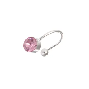 Detailed view of the silver-tone ear cuff featuring a sparkling pink crystal and smooth bead.