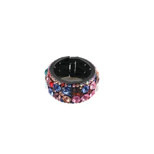 Close up detail of black circular rhinestone hair clip sparkling multi color crystals.