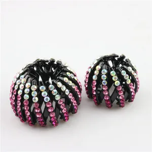 Black rhinestone hair bun maker detail, sparkling crystal hair clip, close-up view.