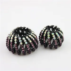 Rhinestone bird nest hair clip detail showing sparkly crystals on black messy bun maker.