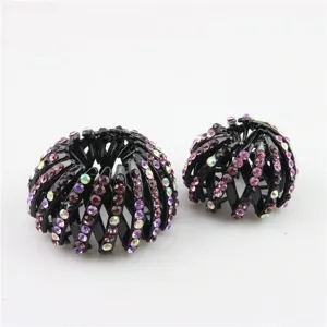 Close-up detail of expandable bird's nest hair clips featuring sparkling rhinestones.