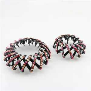 Detailed close-up view of sparkling rhinestone bird nest hair clip showing detailed texture.