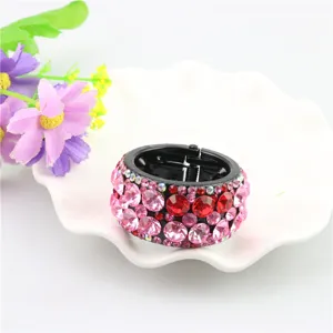 Detailed view of the Korean style rhinestone round ponytail hair clip, sparkling pink and red crystals.