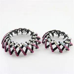 Close-up detail of expandable bird nest hair clips adorned with sparkling pink rhinestones.