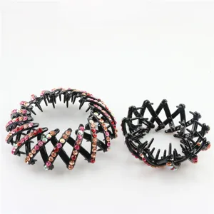Detail close-up of rhinestone bird nest hair clip, sparkling crystal bun maker accessory.