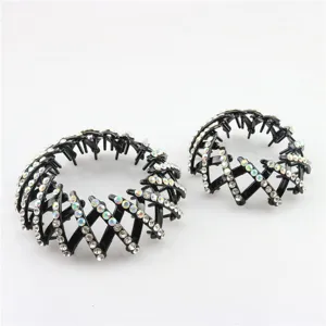 Rhinestone bird nest hair clip detail showing sparkling crystals and flexible plastic design.