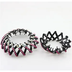 Close-up detail of expandable hair bun maker with shiny rhinestones in black finish.