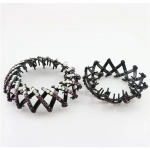 Black plastic bird nest hair clip with sparkling rhinestones for chic styling bun.