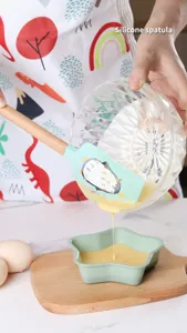 Silicone baking spatula with wooden handle, flexible scraper for cake cream and batter mixing.