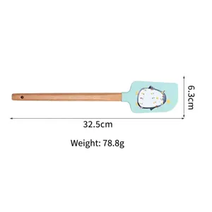 Silicone spatula with wooden handle, heat-resistant baking tool with cute penguin design.