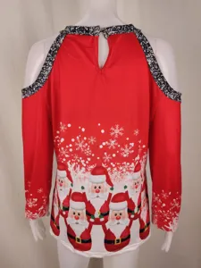Cold shoulder Christmas top detail showing Santa Claus print and sparkling black straps.