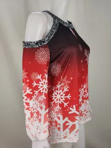 Detailed view of the women's cold shoulder Christmas top with stunning snowflake print.