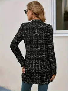 Detail view of the black and white tweed long blazer back design showcasing fabric texture.