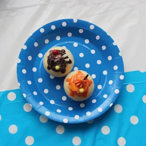 Blue polka dot paper dinner plates set for birthday party decorations and tableware.