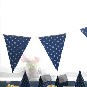 Blue polka dot party decoration set featuring hanging bunting flags and fun party hats for birthdays.