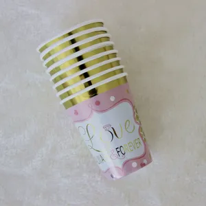 Gold rim pink disposable paper cups for birthday party celebration and event decorations.