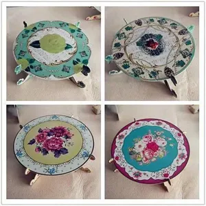 European style paper cake stand detail view, exquisite floral pattern round dessert display tray.
