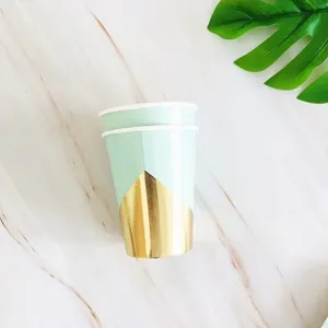 Disposable paper cups for party and picnic, elegant blue and gold geometric design detail.