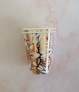 Detailed view of disposable paper cups featuring elegant rose gold foil floral mandala patterns.
