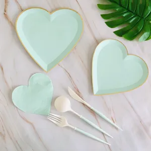 Mint green heart shaped paper plates napkins and cutlery set for party and wedding decor.