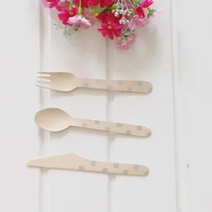 Disposable 16cm wooden cutlery set with polka dots, perfect for kids birthday cake parties.