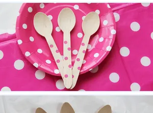 Disposable wooden spoons with pink polka dots, perfect for cakes, desserts, and party use.