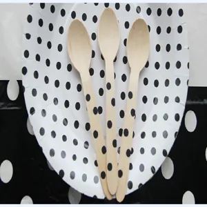Disposable wooden spoons with black polka dots, perfect for desserts, cakes, and takeout food.
