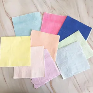 Colorful paper napkins detail view, assorted pastel colors for party and food tray use.