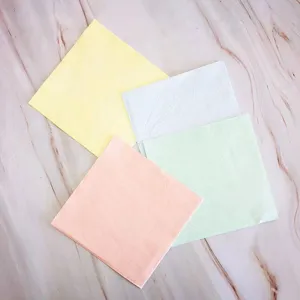 Colorful disposable paper napkins detail view, pastel shades for party decor and baking.