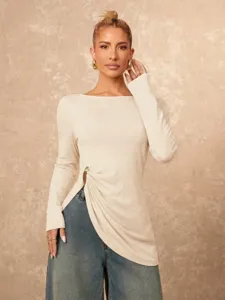 Women's long sleeve top detail showing the chic irregular metal ring side slit and slim fit design.