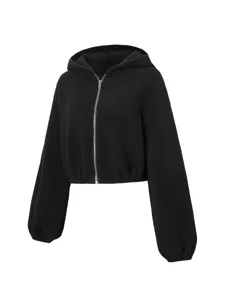 Close-up detail of black fleece zip-up hoodie, soft fuzzy texture and elastic cuffs.