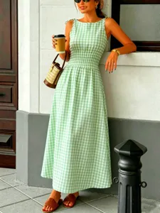 Green gingham midi dress detail, featuring a crew neck, sleeveless and smocked waist.