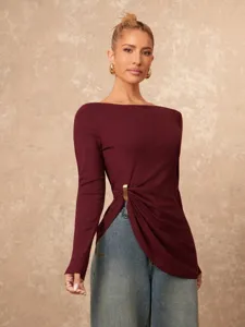 Asymmetrical long sleeve top with metal buckle detail, stylish slim fit detail view.