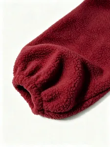 Close up of plush fleece jacket sleeve with elastic cuff detail, showing soft texture and cozy.